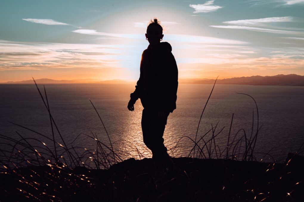 decorative image, person on hill, backlit