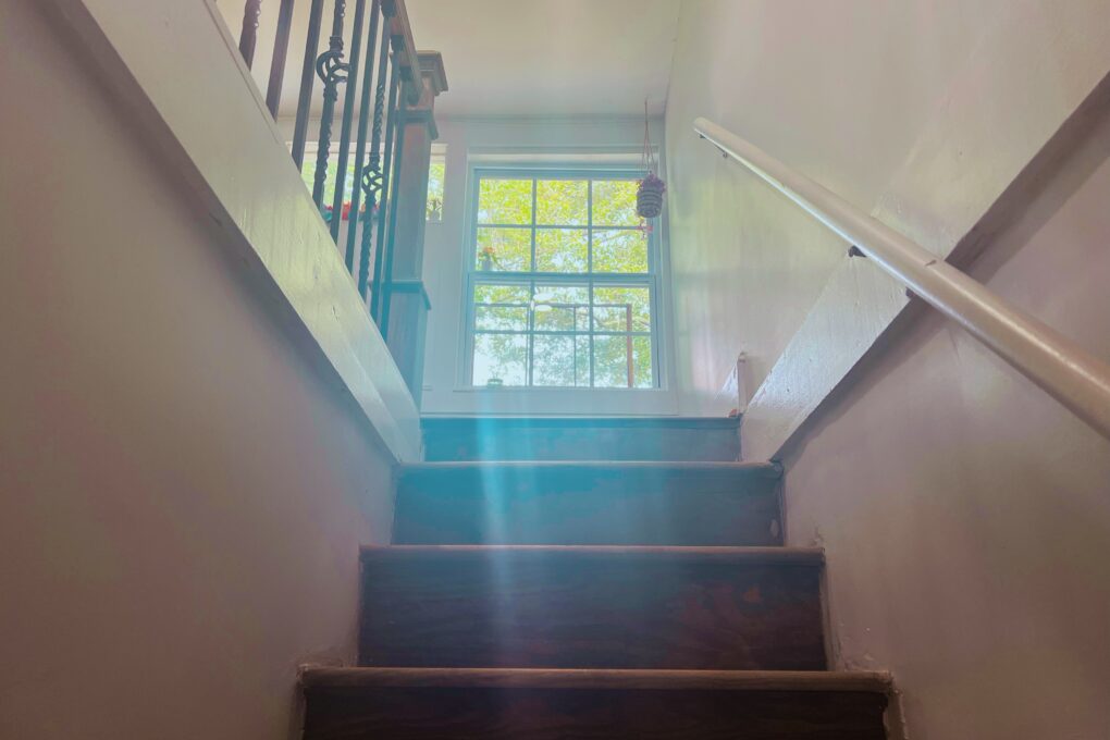 image of staircase with window at the top